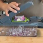 Chopped red onion in Tzatziki Chicken Salad